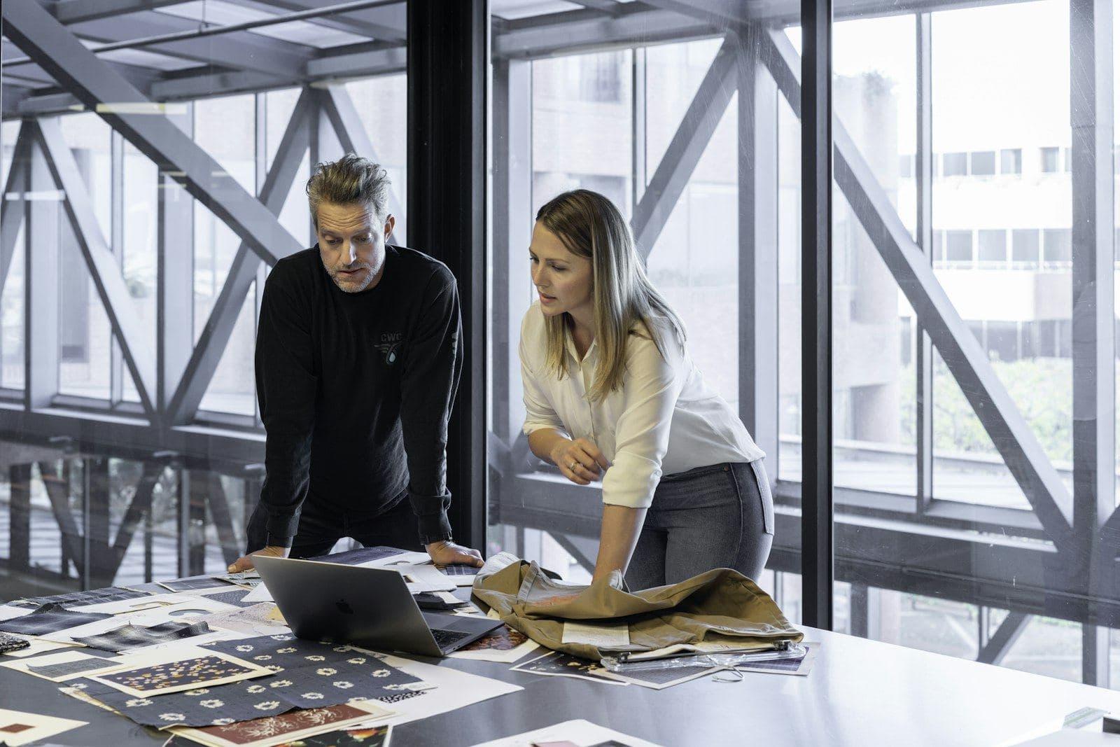 Two colleagues working through a plan together